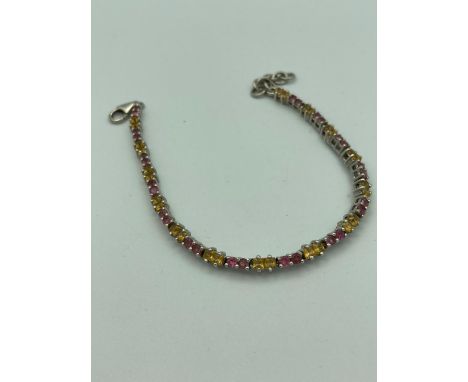 SILVER and TOURMALINE TENNIS BRACELET having 28 pink and 28 yellow tourmaline gemstones set in silver mounts.Complete with or