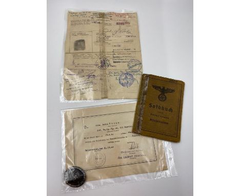 Kriegsmarine Pay book, 3rd Class Wound Badge with Citation & P.O.W Discharge Sheet for a German Sailor who was transferred to