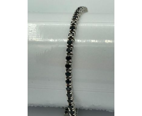 SILVER and BLACK SPINEL slider BRACELET having gemstones set and mounted in tennis bracelet style.Adjusts to any size. Comple