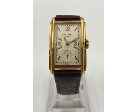 A VINTAGE 18K GOLD PATEK PHILIPPE WITH RECTANGULAR CASE AND LEATHER STRAP. 29 X 22mm 