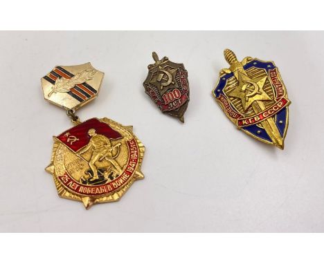 3 RUSSIAN ENAMEL AND GILT BADGES , KGB PLUS 2 OTHERS. 