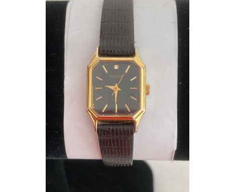 Ladies ACCURIST QUARTZ WRISTWATCH ,Square black face model in gold tone having sweeping second hands with diamond at 12 O?clo