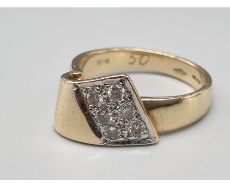 A 9K Yellow Gold Diamond Set Fancy Band Ring. .25c diamonds. 4g. Size O. 