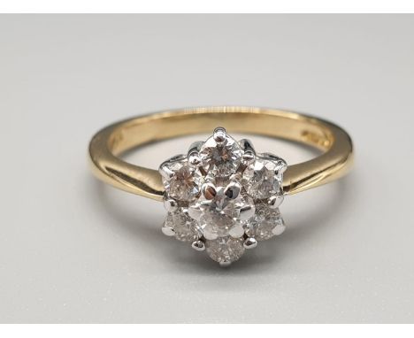 An 18K Yellow Gold Diamond Flower Cluster Ring. Size K. 3.4g 