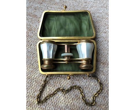 Vintage pair of quality mother of pearl opera glasses ,complete with green hard purse and chain. 