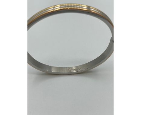 Ladies white and yellow metal bangle. 