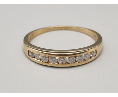 A 9K Yellow Gold Half Eternity Diamond Ring. Size N.0.25ct. 1.6g. 