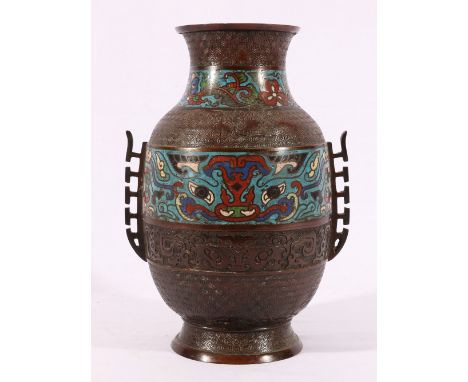 Chinese champleve enamel vase with two inlaid bands on a taotie and diaper ground, flange handles, 29cm