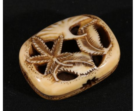 Japanese bone Manju netsuke, carved and pierced with leaves and blossom, 4.5cm Meiji