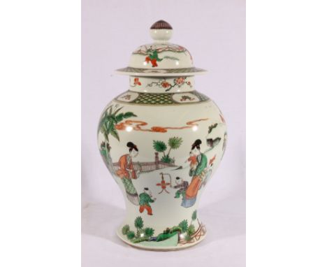 Chinese 19th century famille verte baluster jar and domed cover, the body decorated with figures in a garden setting, Kang Xi