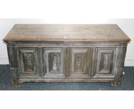 Antique oak hinge-topped coffer or kist, with four  panel front, raised on bracket feet, 133cm.