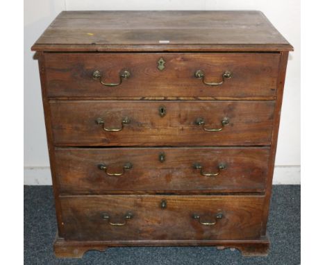 Early 19th century oak and pine chest of drawers, the rectangular top with moulded edge, above four graduated drawers, raised