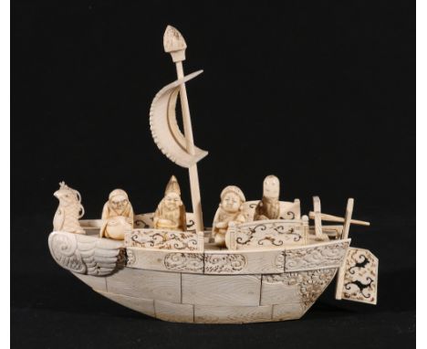Japanese sectional ivory model of the Shichi Fukujin on a boat, carved and pierced detail, 21cm, Meiji / Taisho