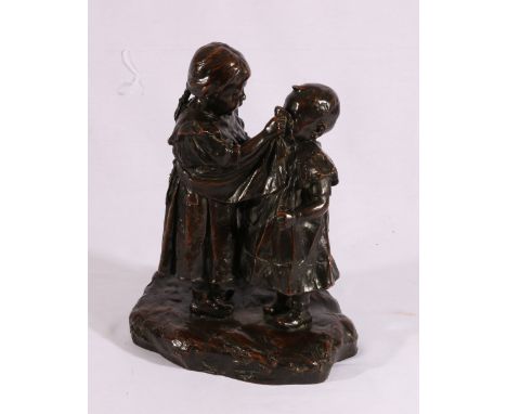 BERNHARDT SCENSEN? Girl wiping a Boy's face Bronze, signed and dated '13, 30cm