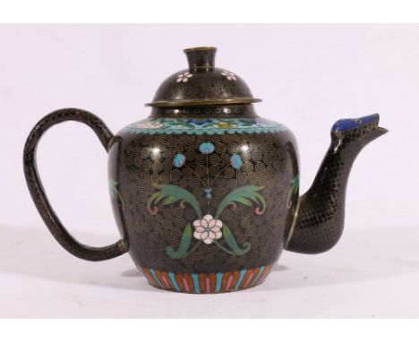 Chinese cloisonne teapot, the background decorated with flowers and foliage on a scroll ground, serpent spout, 20 x 13cm.