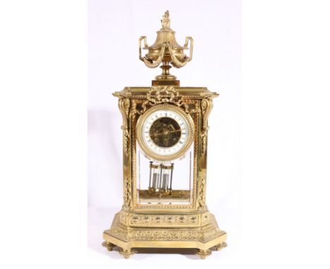 19th century gilded brass mantle clock, the dial with visible escapement and Roman numeral and Arabic numeral chapter rings, 