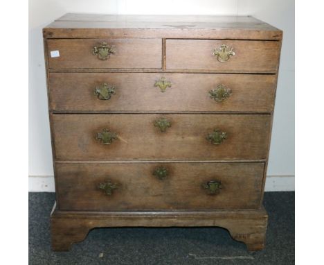 George III oak chest, the rectangular top over two short and three long graduated drawers raised on bracket feet. 97cm wide, 