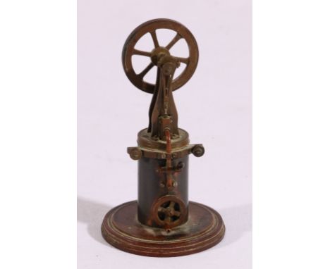 Miniature model in brass of a steam pump with fly wheel, wooden base. 10.5cm