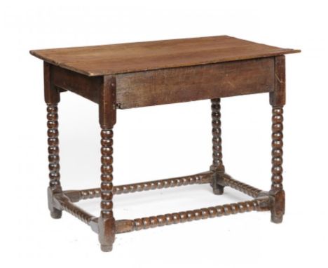 AN OAK SIDE TABLE, 17TH C AND LATER  with boarded top and bobbin turned legs and stretchers, 70cm h; 57 x 94cm++Restored