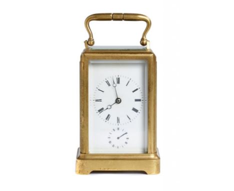 A FRENCH GILT BRASS CARRIAGE CLOCK, LATE 19TH C the 'one piece' case with the bell striking movement with alarm and retaining