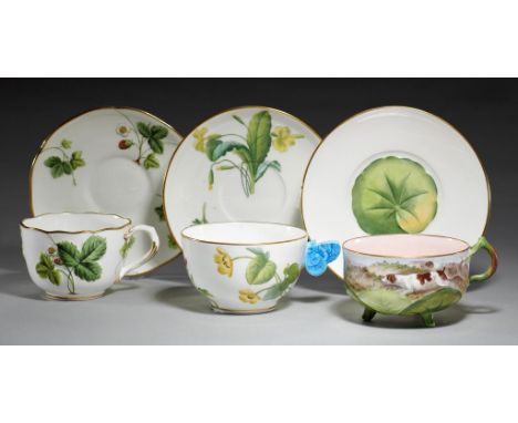 THREE MINTONS BREAKFAST CUPS AND SAUCERS, 1869 AND C one moulded and painted with wild strawberries, another with lily pad fe