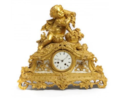 A FRENCH ORMOLU MANTLE CLOCK, C1870 with bell striking movement, the swept case inset with white marble panels and surmounted