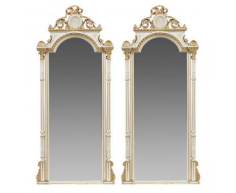 A PAIR OF GILT AND PALE GREY PAINTED WOOD AND COMPOSITION PIER MIRRORS, 19TH C  crested by foliage and bow, the breakarched b