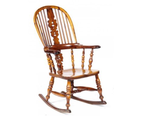 A VICTORIAN YEW WOOD WINDSOR BOW BACK ROCKING CHAIR, NOTTINGHAMSHIRE,  19TH C with elm seat, 107cm h