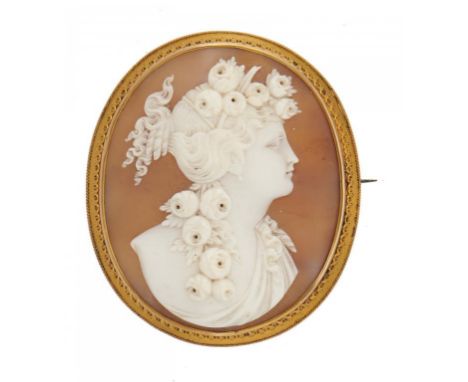 A CAMEO BROOCH, LATE 19TH C the oval shell carved with the head of a bacchante mounted in gold mount, 4.7 x 7.4cm ++Under tra