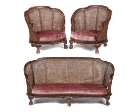 A GADROON CARVED SERPENTINE MAHOGANY BERGERE SUITE, C1930  the reeded frame with acanthus leaves and beading, on dwarf cabrio