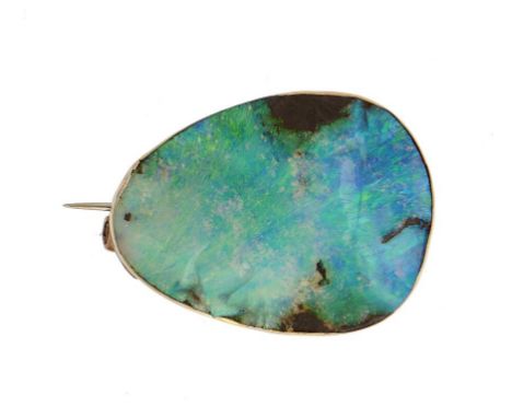 AN ASYMMETRICAL 'ROUGH' OPAL BROOCH  plain gold mount, 2.9cm l, unmarked, 8g++Good condition, the polished chips around the e