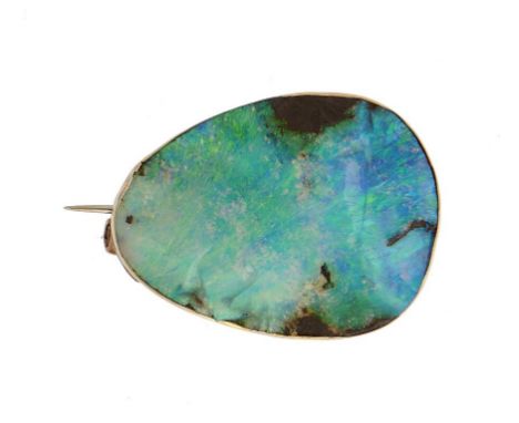 AN ASYMMETRICAL 'ROUGH' OPAL BROOCH  plain gold mount, 2.9cm l, unmarked, 8g++Good condition, the polished chips around the e