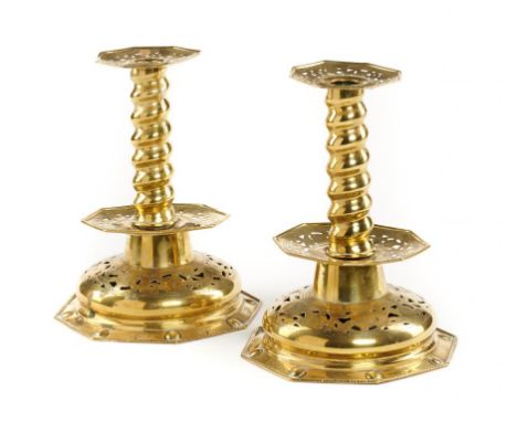 A PAIR OF DUTCH SHEET BRASS CANDLESTICKS, EARLY 20TH C in 17th c style, on domed and pierced octagonal foot, 24cm h++Parts lo