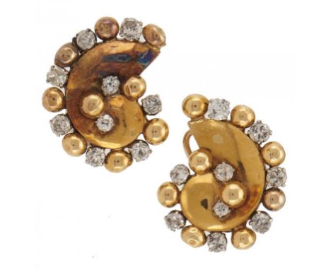 A PAIR OF DIAMOND SHELL SHAPED EARRINGS, MID 20TH C in two colour gold with round brilliant cut diamonds, clip fittings, 2.1c