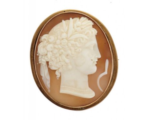 A CAMEO BROOCH, 19TH C  the oval shell carved with the head and emblem of Ceres, mounted in  gold, 5cm++One or two very fine 