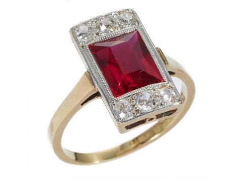 A STEP CUT RED STONE AND DIAMOND RING, C1930  millegrain set with old cut diamonds in gold, maker RP and marked 18CT &amp; PL