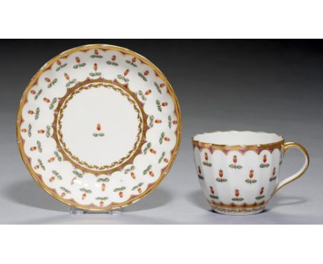 A PINXTON FLUTED CUP AND SAUCER, 1796-1813 with a formal rose hip pattern in purple,  saucer 13cm diam++Cup with hairline cra