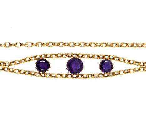 AN AMETHYST NECKLACE the gold chain with three round amethysts and demountable for wear as a bracelet, 34.5cm, marked 9K, 27g