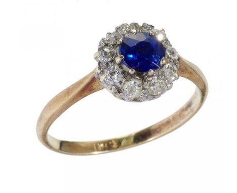 A SAPPHIRE AND DIAMOND CLUSTER RING, EARLY 20TH C  with old cut diamonds in gold, marked 18ct, 2.5g, size L++Sapphire in good