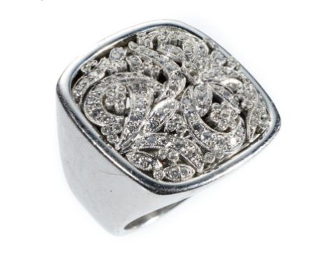 A DIAMOND RING of cushion shape and tendril design, millegrain set, in white gold, marked 18K, 33g, size O½ ++Second hand con