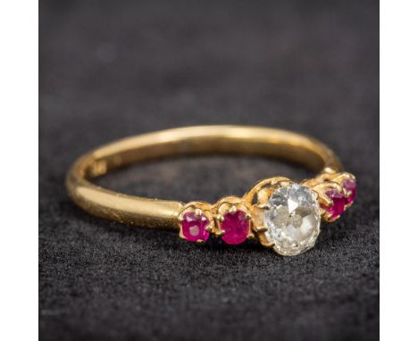 An 18 ct gold diamond and ruby set ring
The central stone approximately 0.5 carats. CONDITION REPORTS: Generally good conditi