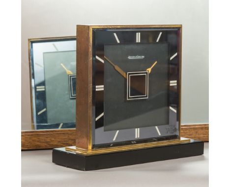 An Art Deco Jaeger LeCoultre double faced desk clock
Of flattened square section form with lacquered brass banding, each face