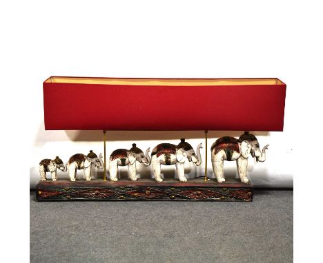 Large Indian carved wood light, designed with a family of elephants rectangular base, with shade, height 72cm.