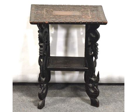 Anglo-Indian carved hardwood table, rectangular top, scrolled legs joined by a shelf, 49x40cm, height 63cm.