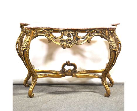 Modern gilt console table, serpentine variegated marble top (damaged), scrolled base, width 135cm, depth 58cm, height 93cm.