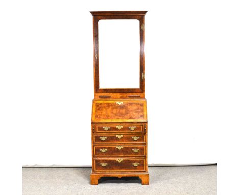 George I style walnut bureau bookcase, moulded cornice, the upper section with bevelled mirrored glass door above candle slid