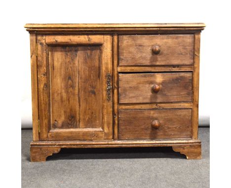 Pine cupboard, the top with moulded edge, fitted with a cupboard door and three drawers, bracket feet, width 108cm, depth 51c