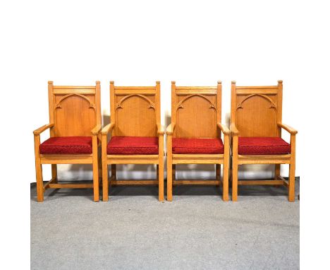 Four Ecclesiastical oak elbow chairs, Gothic style with tracery panel backs, mid-to-late 20th century, removable cushion seat