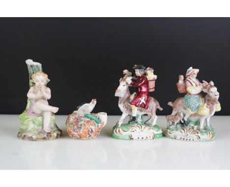Pair of 19th century Derby style figures, The Welch Tailor and Wife, he seated astride a goat, wearing a tricorn hat with a p
