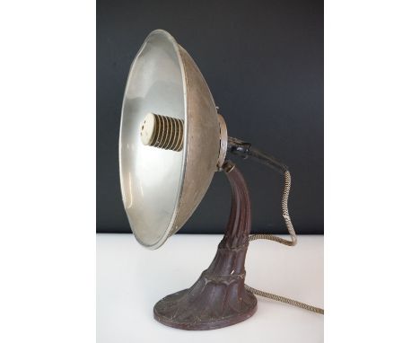 Mid 20th century retro heat lamp with steel shade on a cast iron stand with geometric decoration, approx 42cm high 